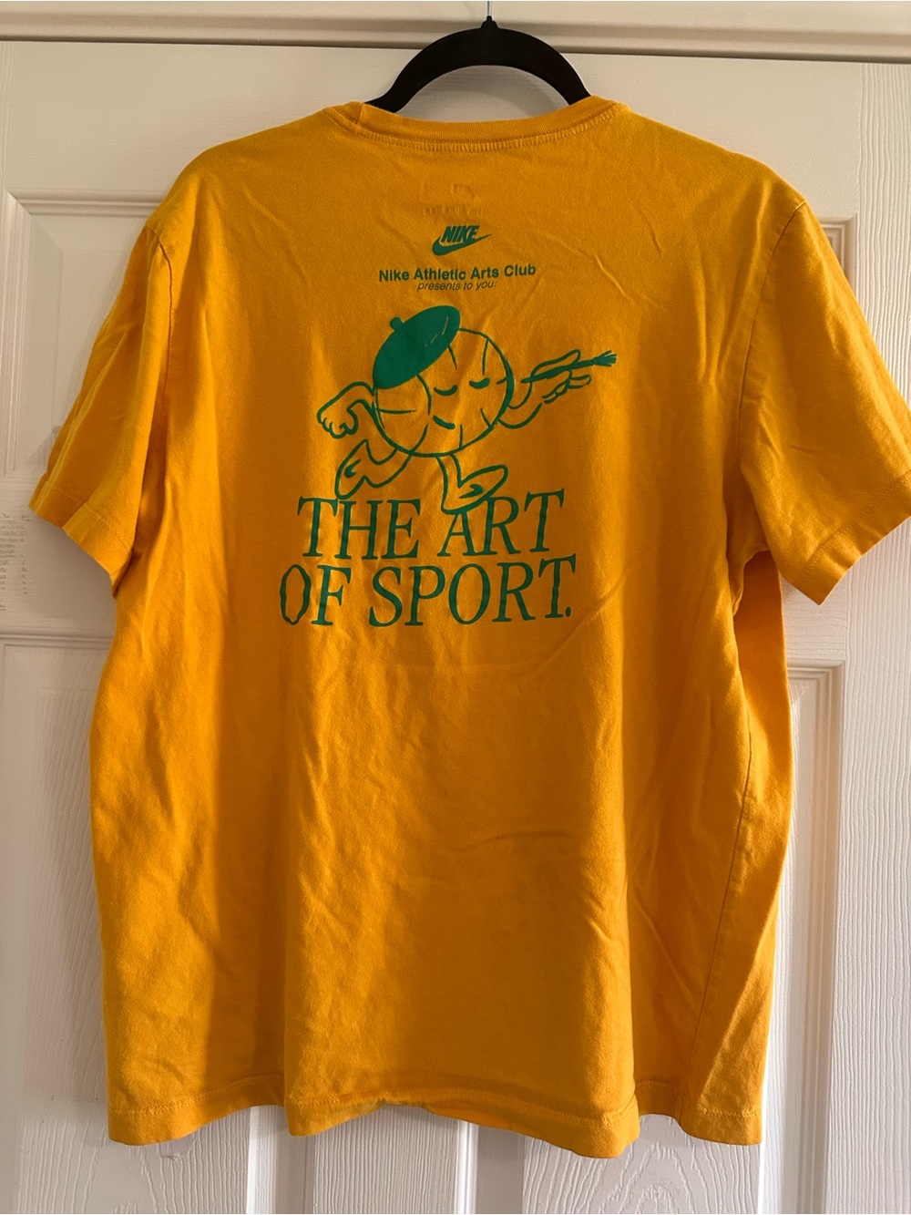 Nike Yellow 'The Art of Sport' Graphic Tee with Green Print